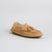 Tan suede loafer with tassel detail and crepe rubber sole, shown from the side.