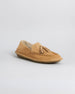 Tan suede loafer with tassel detail and crepe rubber sole, shown from the side.