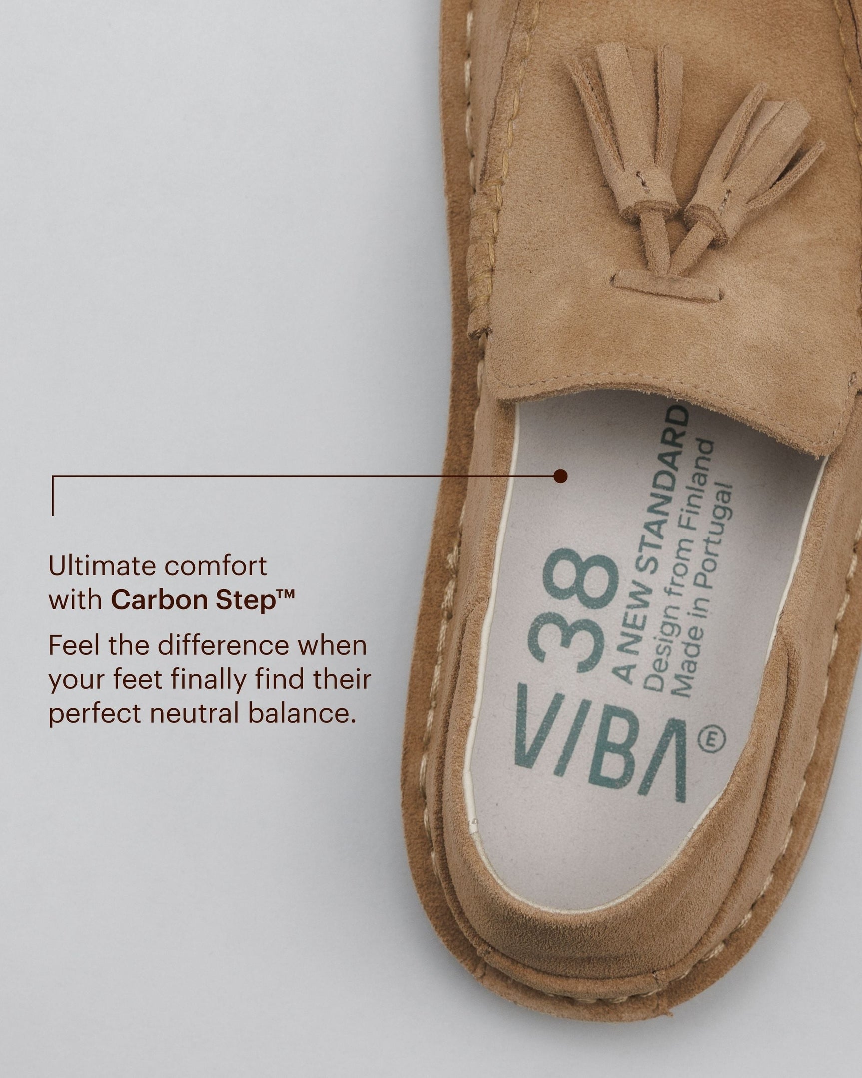 Tan suede desert shoe with tassel detail and visible insole label showing VIBA branding and Carbon Step technology.